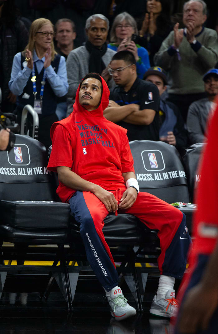 Washington Wizards guard Jordan Poole watches a tribute to him on the big screen by his former team, the Golden State Warriors before the start of their game at Chase Center.